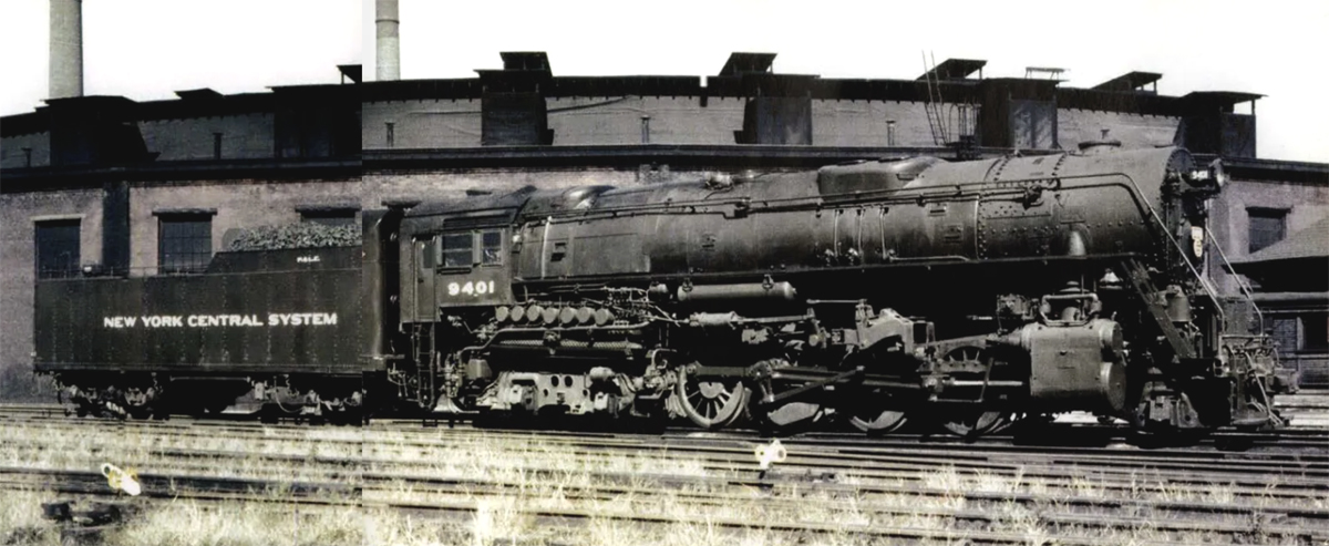 A black Berkshire steam locomotive and tender is shown stationary in a vintage color photo