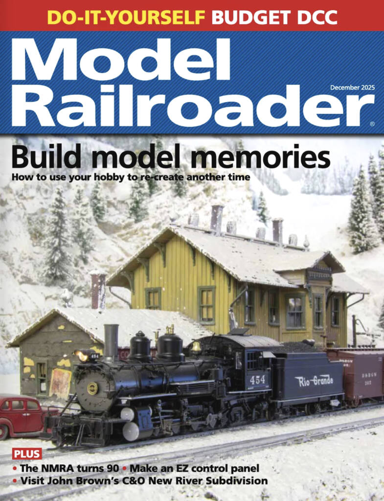 The December 2025 cover of Model Railroader which features a model steam train passing a yellow depot structure on a snow covered model railroad layout