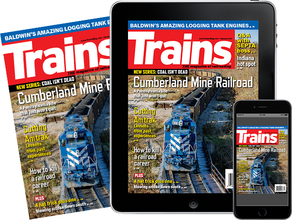 A physical copy of Trains alongside a tablet and mobile phone featuring covers of the issue