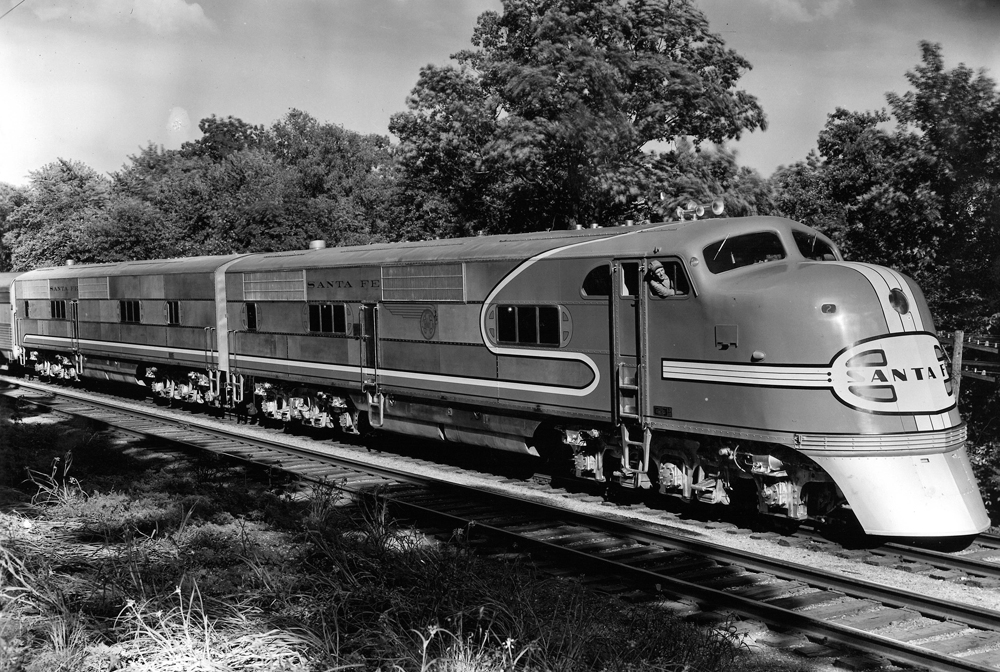 A closeup of a santa fe train sitting on the tracks