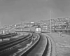 Passenger trains on curve in station
