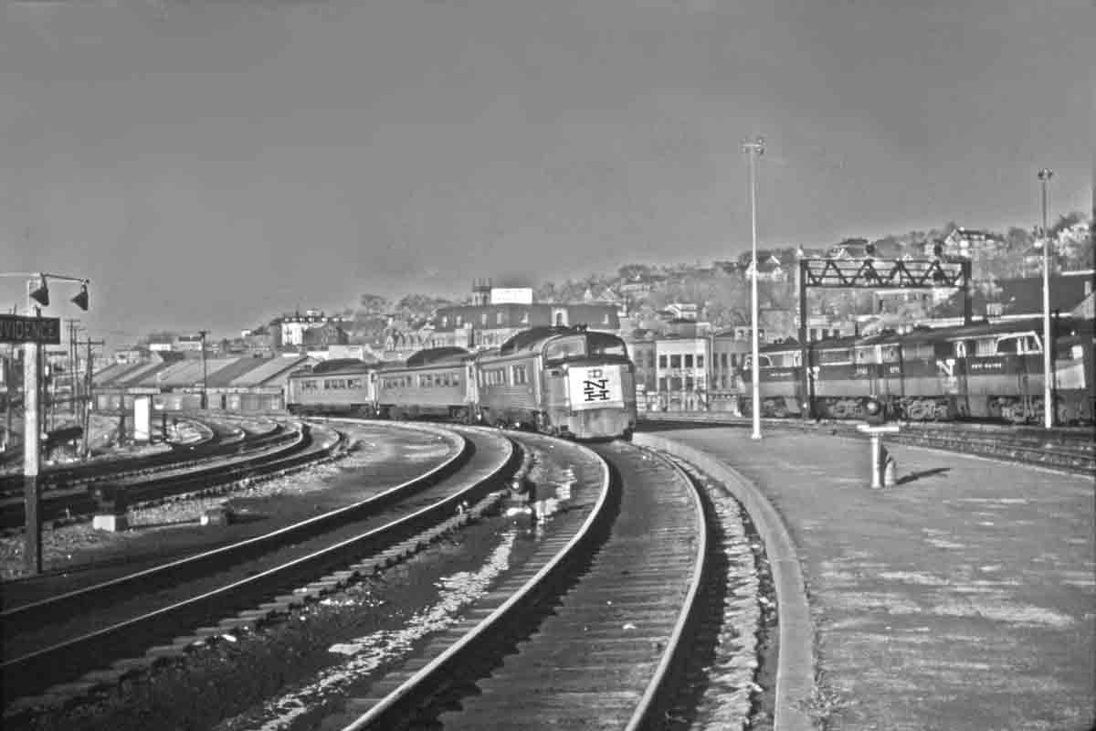 Passenger trains on curve in station