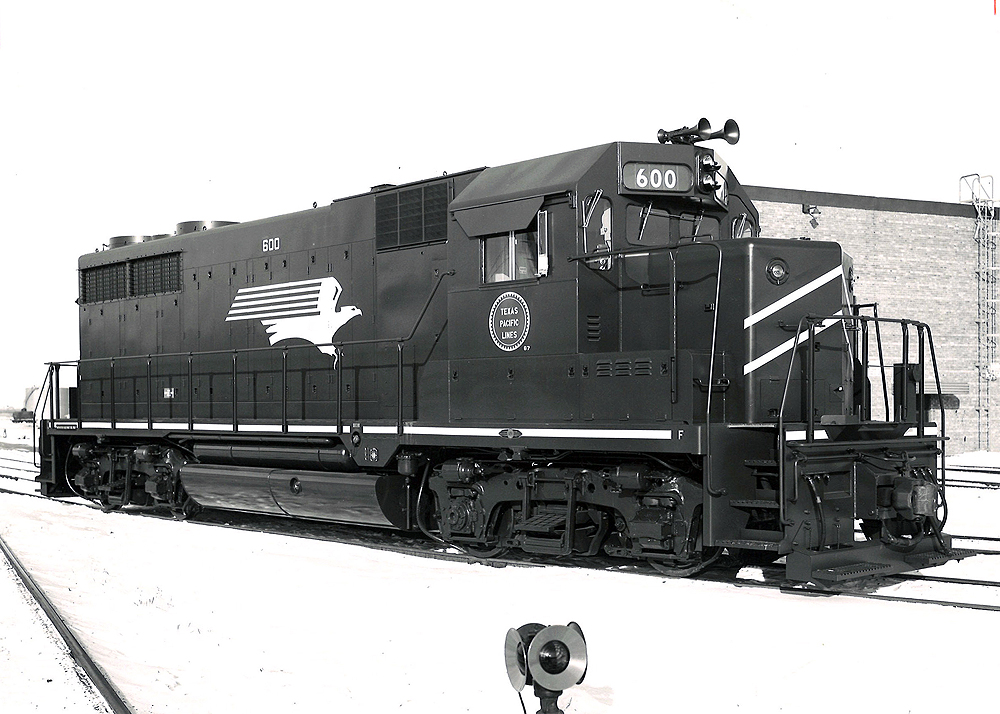 A diesel train sitting on the tracks