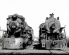 Smoking steam Frisco and Missouri Pacific locomotives at service tracks