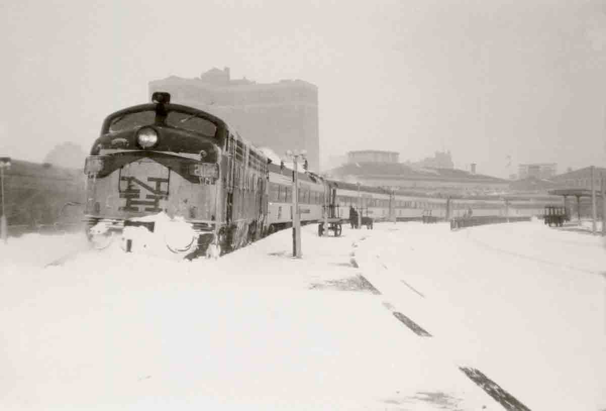 Passenger train on curve in snow