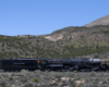 Union pacific passing by with mountains in the background