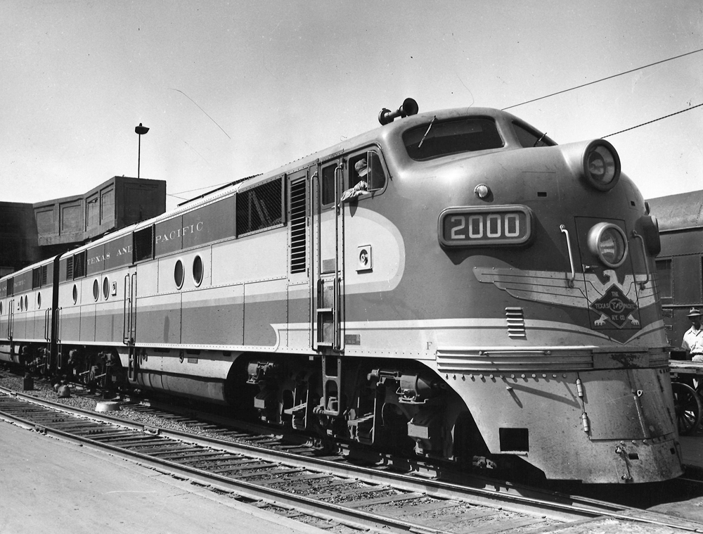 A closeup shot of a train sitting on the tracks