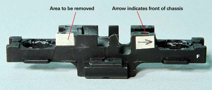 How to add DCC sound to a compact HO switcher: An image of a model locomotive chassis