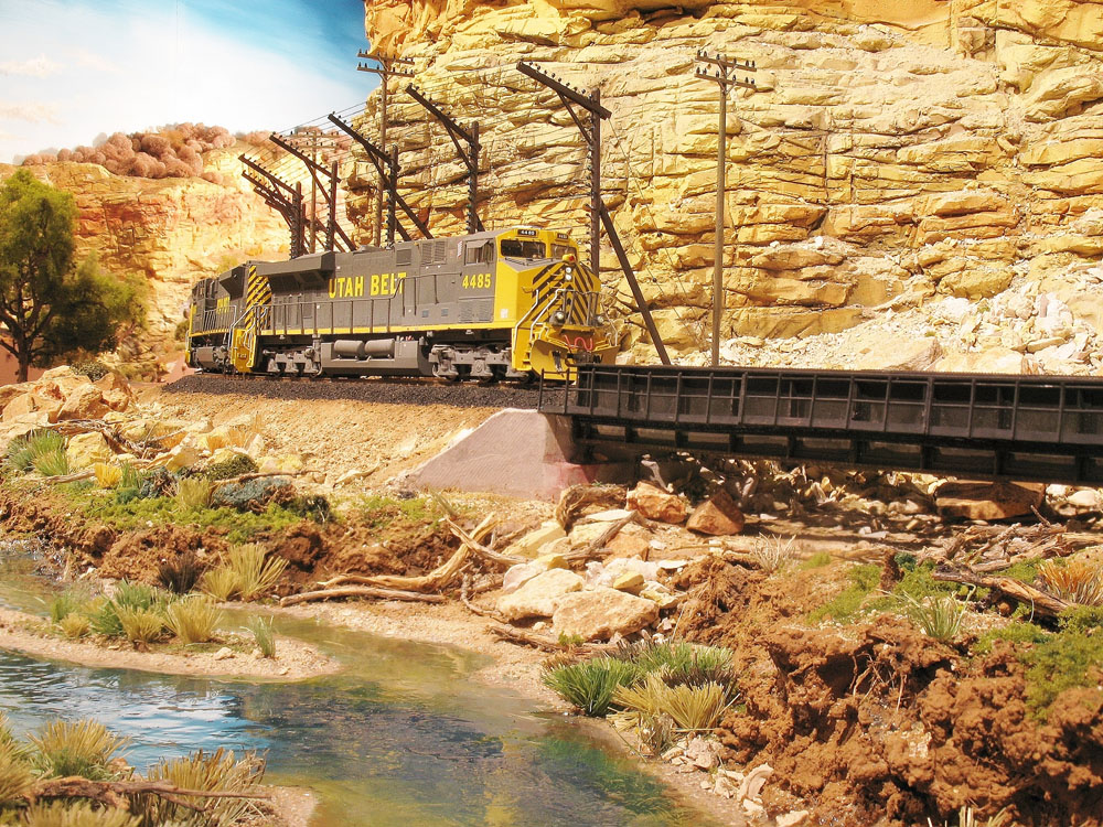 Train passing by a body of water