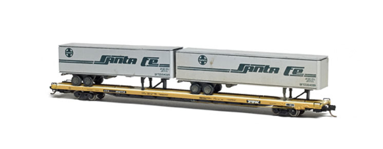 How to keep N scale piggybacks on track: An image of a model flatcar carrying semi trailers