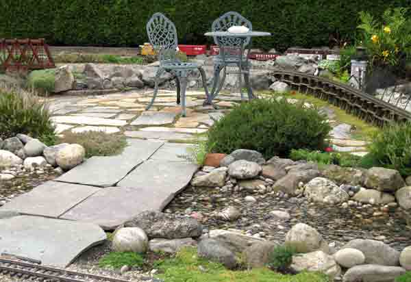 patio table next to garden railway
