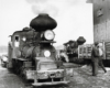 A train sitting outside a lumber yard