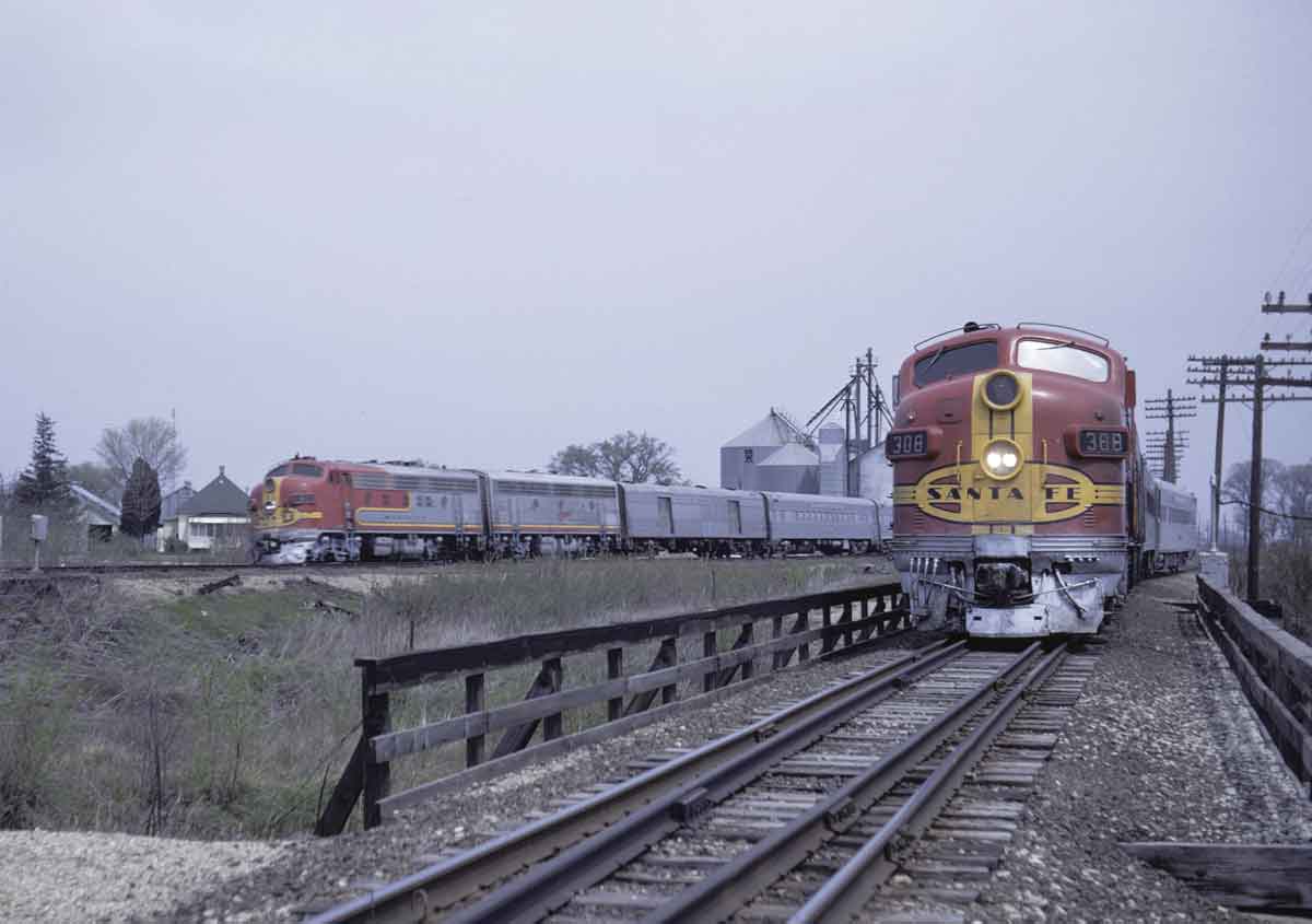 Two passenger trains on diverging tracks