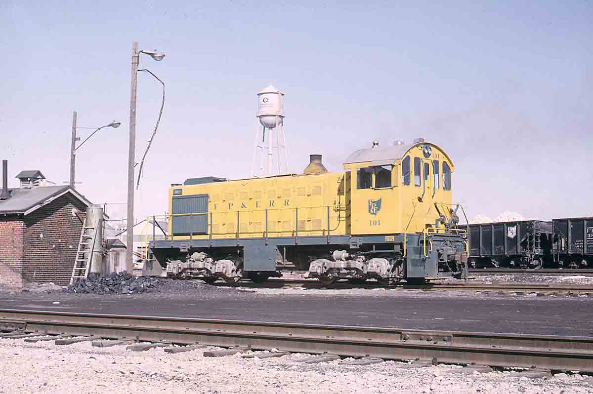 Yellow diesel switcher in yard
