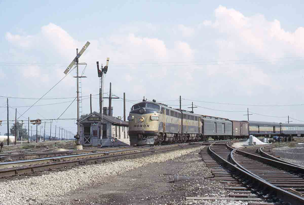 Black and gold passenger train on curve
