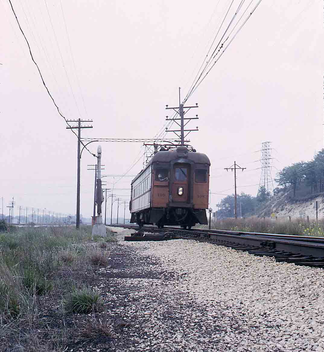 Orange electric interurban rail car