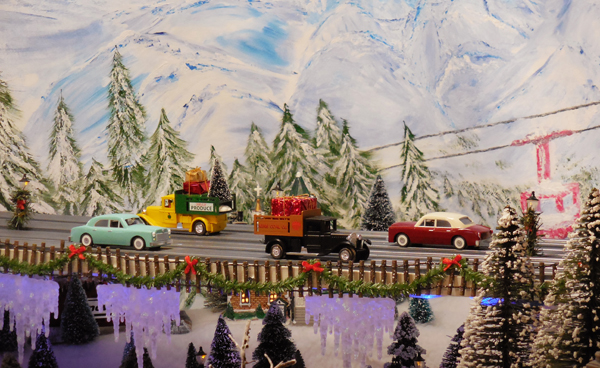 vehicles on toy train layout