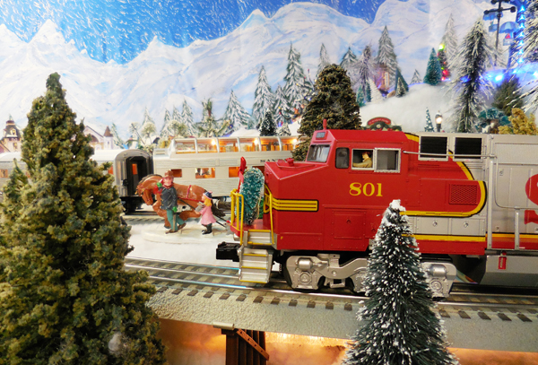 red and silver model train on layout