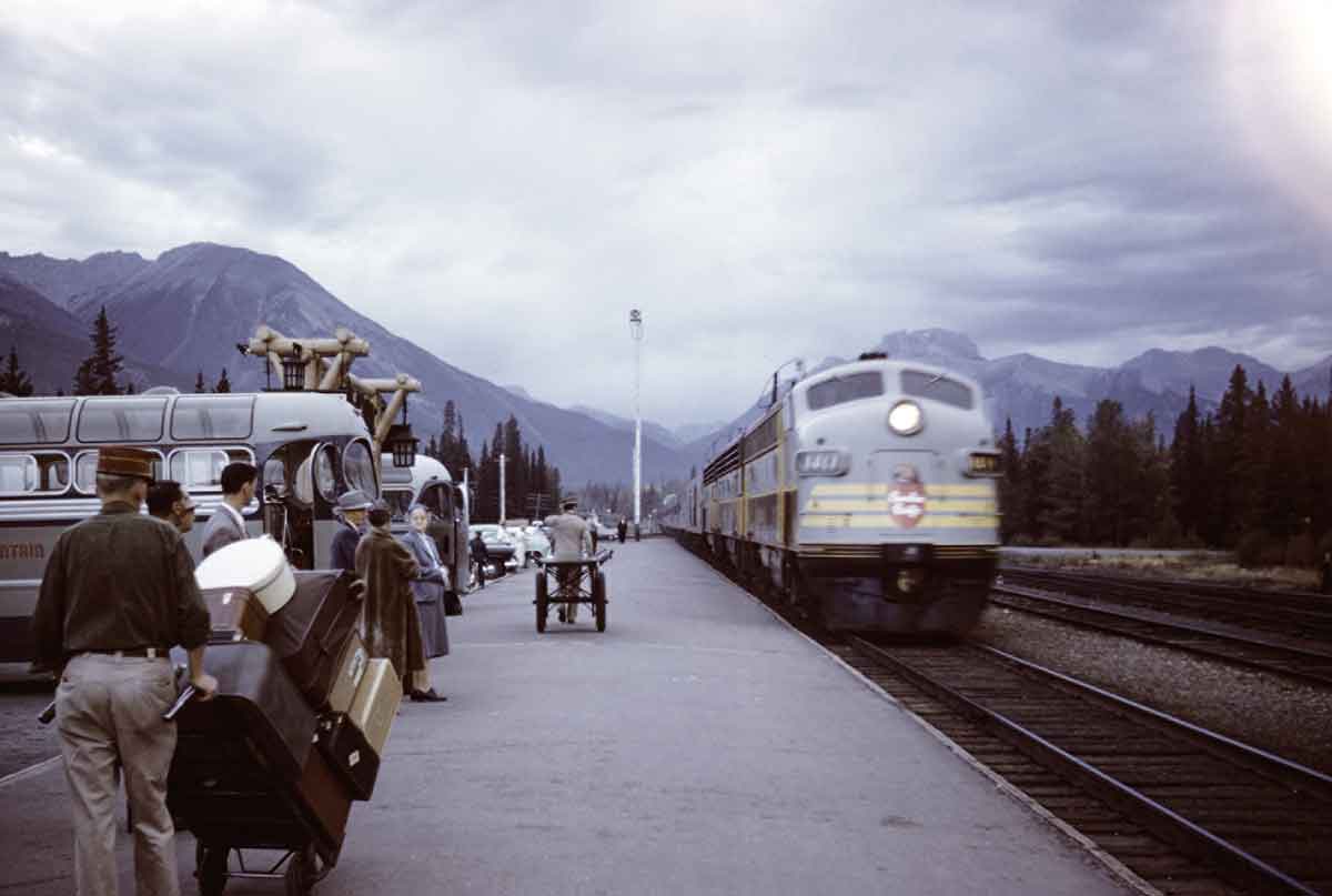 Passengers wait to board diesel powered passenger train