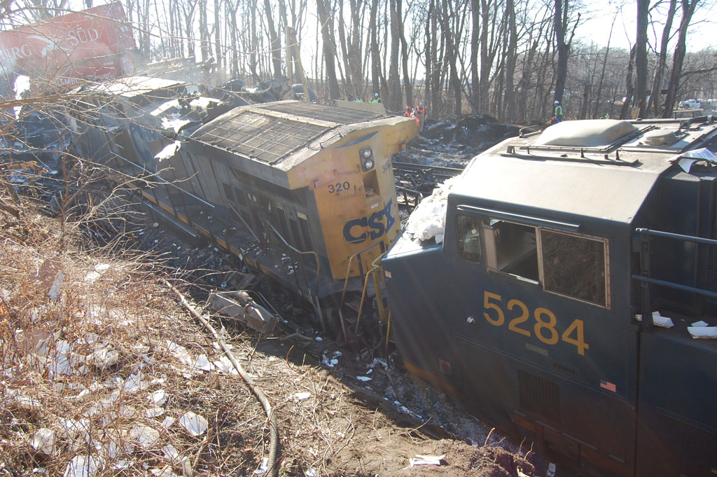 A close up picture of a derailed train
