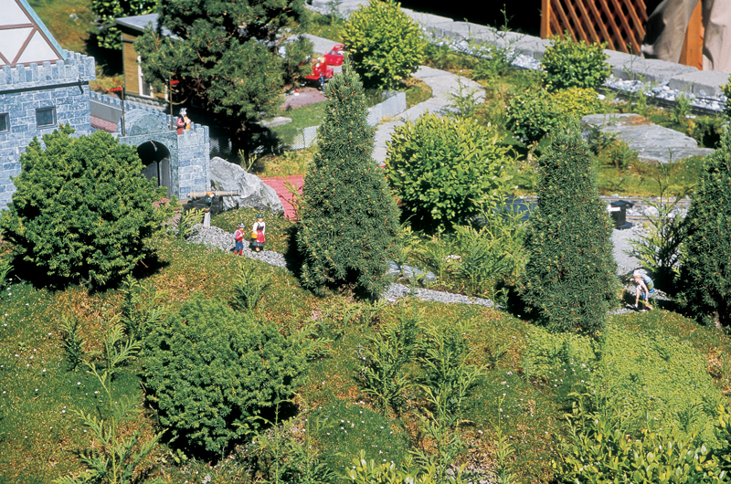 scene on garden railway with lots of green and trees