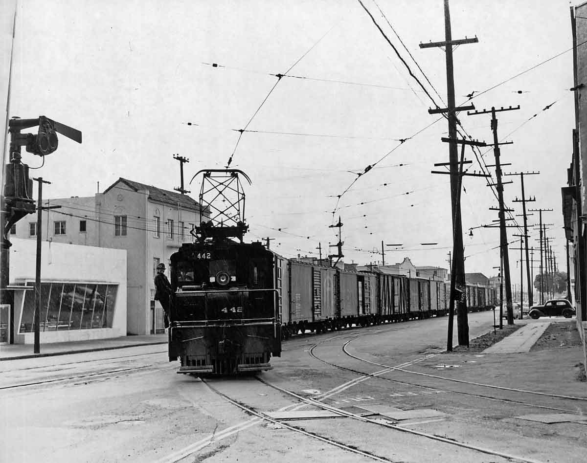 Electric locomotive on freight train in street