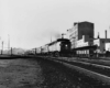 Diesel locomotive on passenger train in city