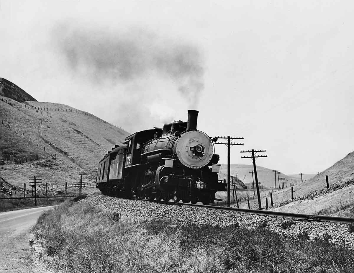 Steam locomotive on curve in hills