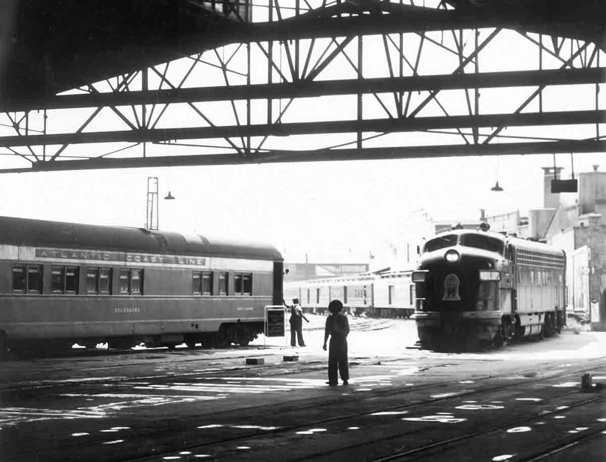 Two passenger trains under train shed