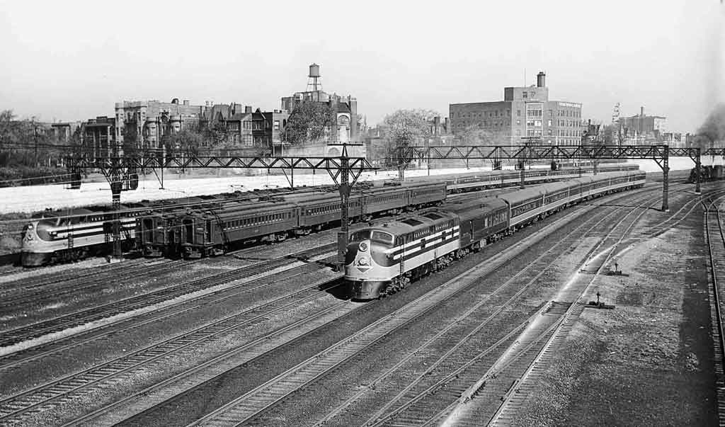 three trains with New Orleans in the background
