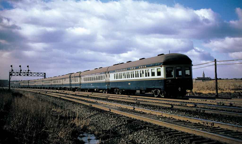A train moving through a rural area