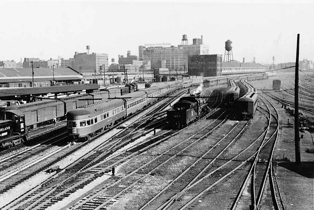 freight and passenger trains in a train yard