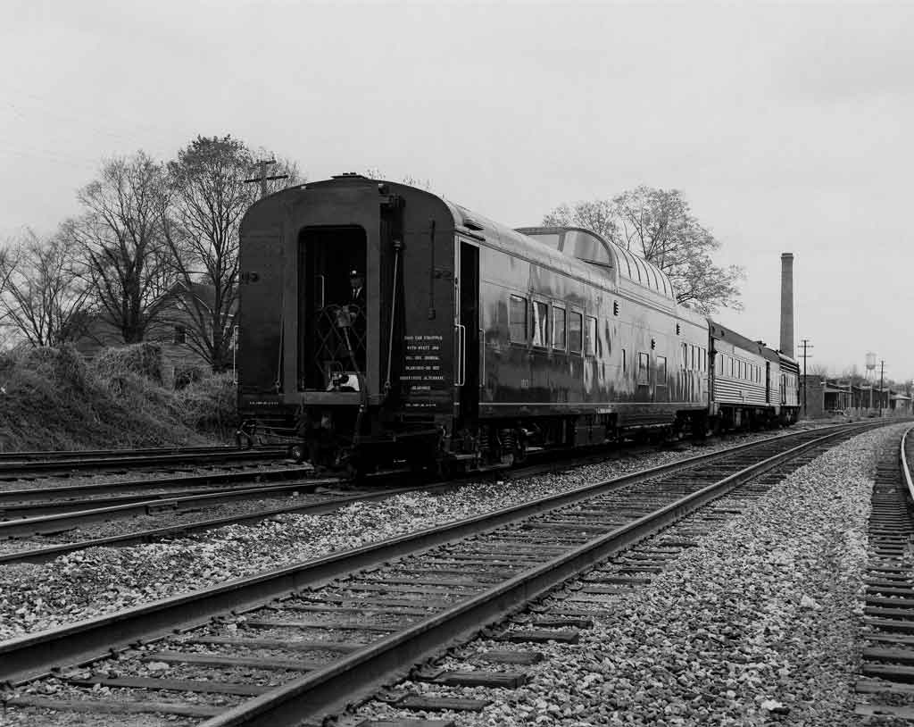 A black and white picture of the back of a train