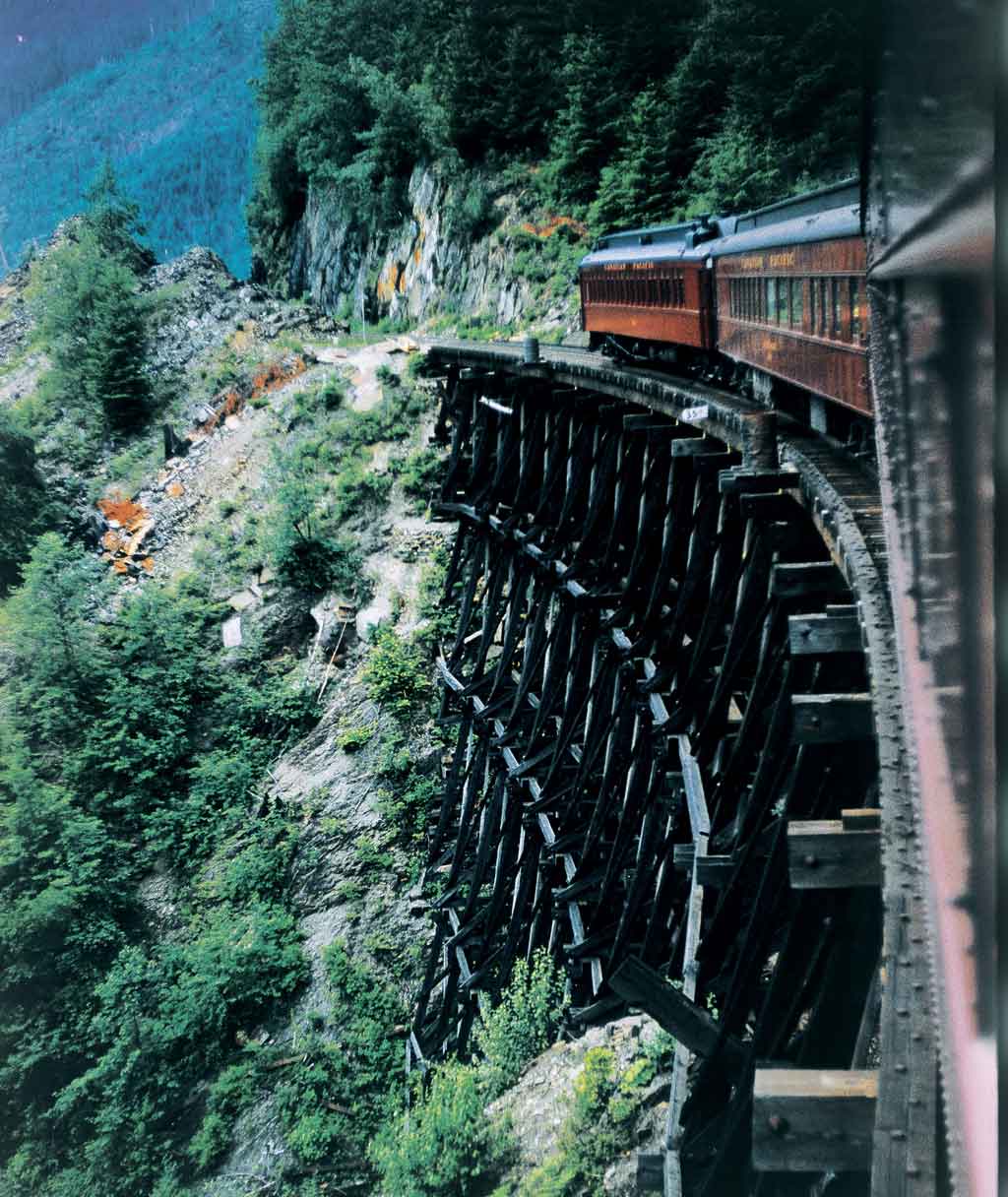 Rear of passenger train on wooden trestle