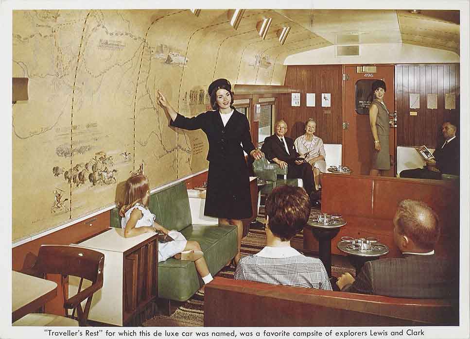 A postcard of a stewardess talking to the passengers in a lounge car