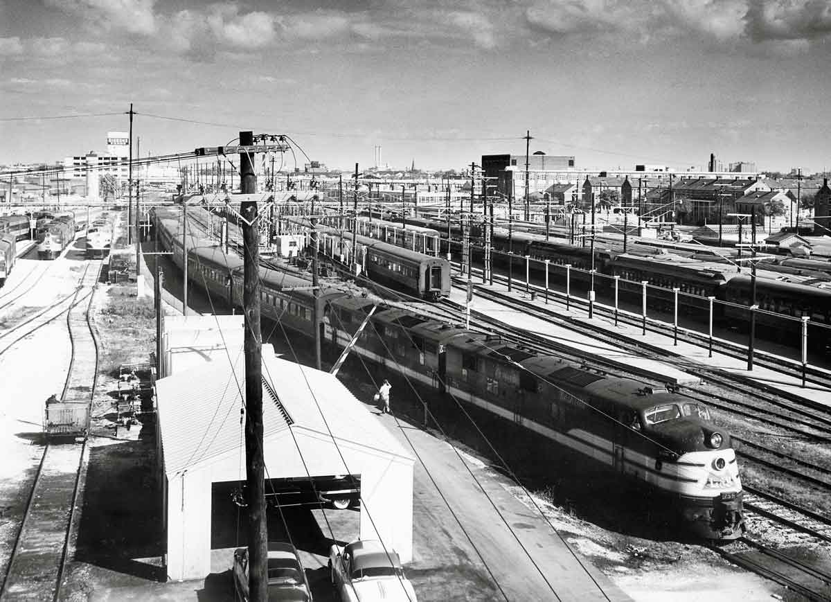 A black and white overhead photo of a handful of trains at a terminal