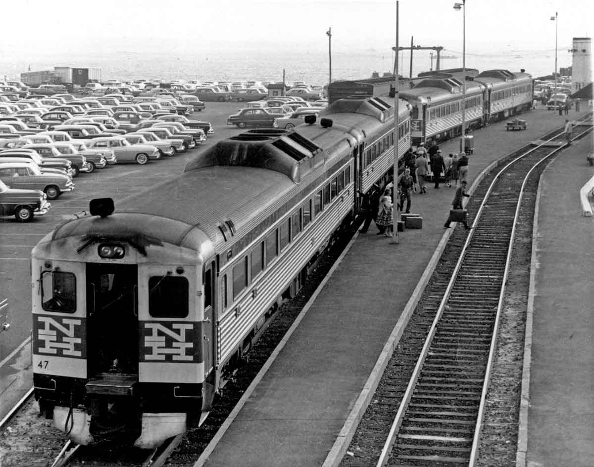 people boarding a passenger train