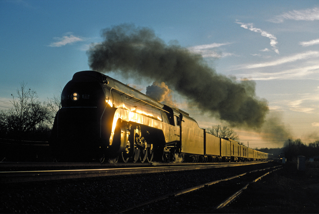 A train passing by during sunset
