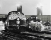 Passenger trains side by side in station