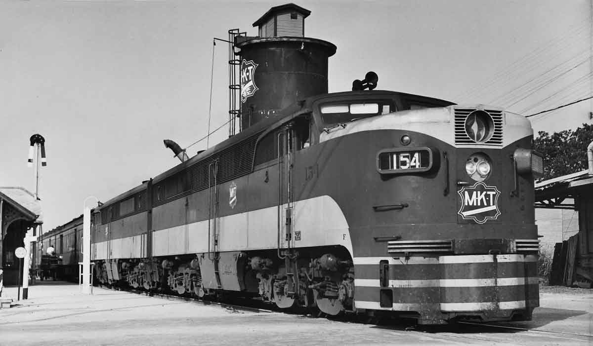 a passenger train at a depot