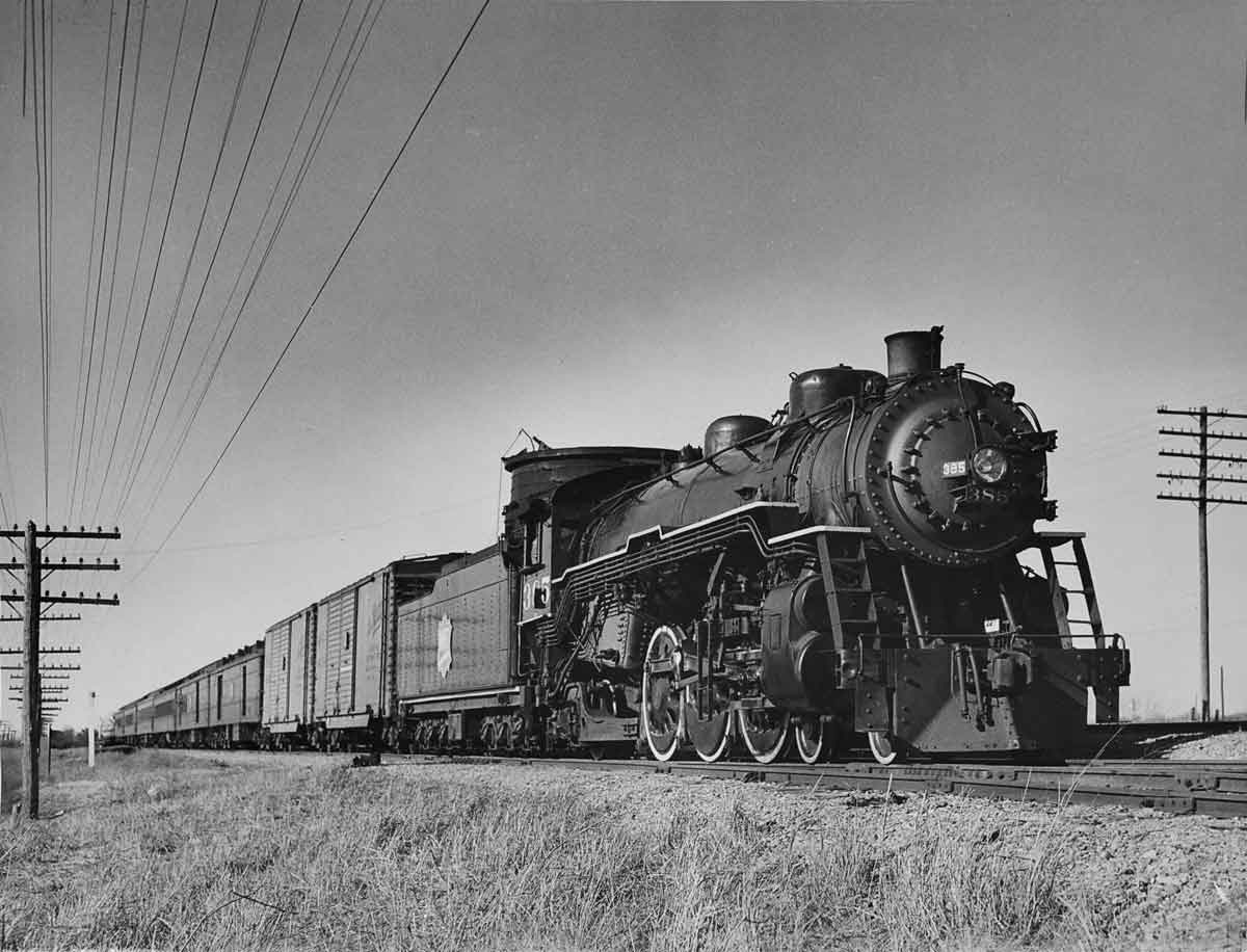 a steam engine and passenger cars