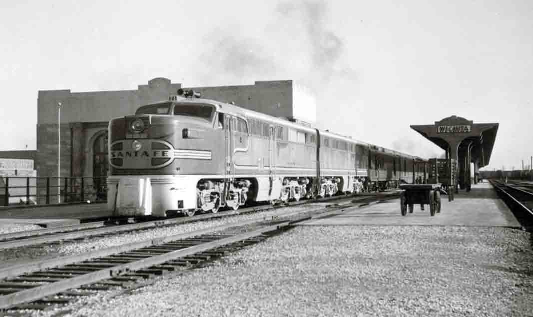 A passenger train waiting for passengers at the station