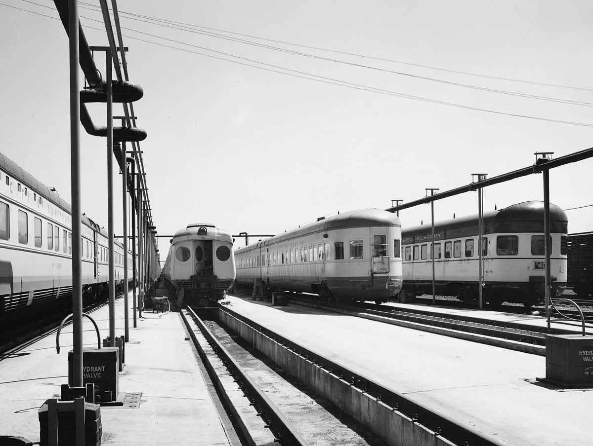 passenger trains sitting in a terminal