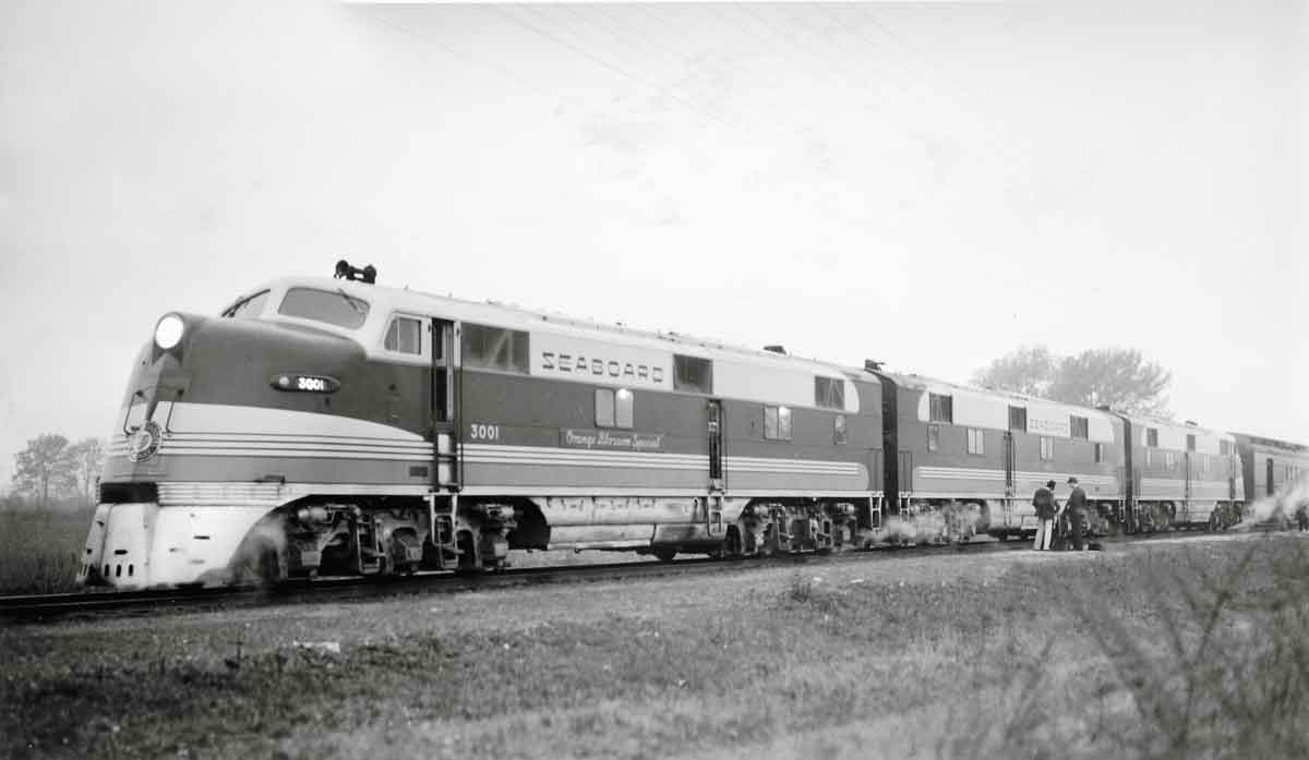 Diesel locomotives hauling a passenger train.