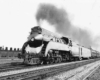 a streamliner pulling passenger cars