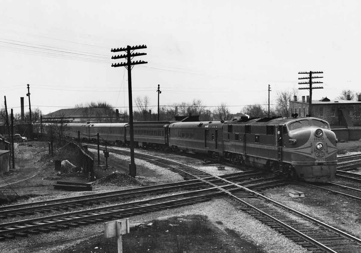 a diesel pulling passenger cars through an intersection