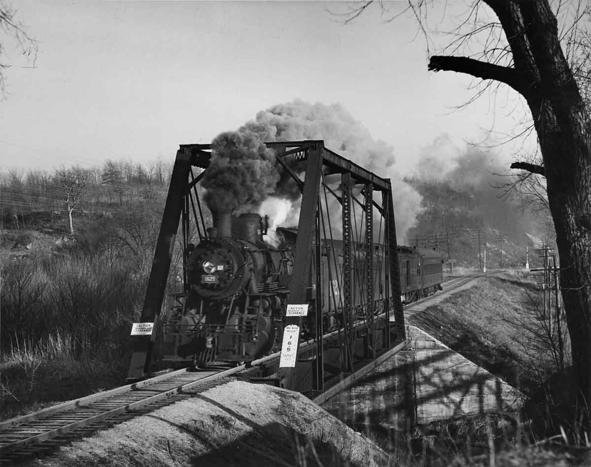 a steam engine crossing a bridge