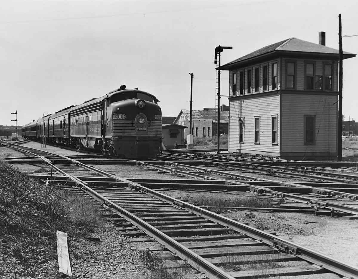 a passenger train passes a train watchtower