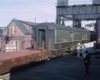 a passenger car getting rolled onto a ferry