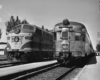 a diesel sitting next to an observation car